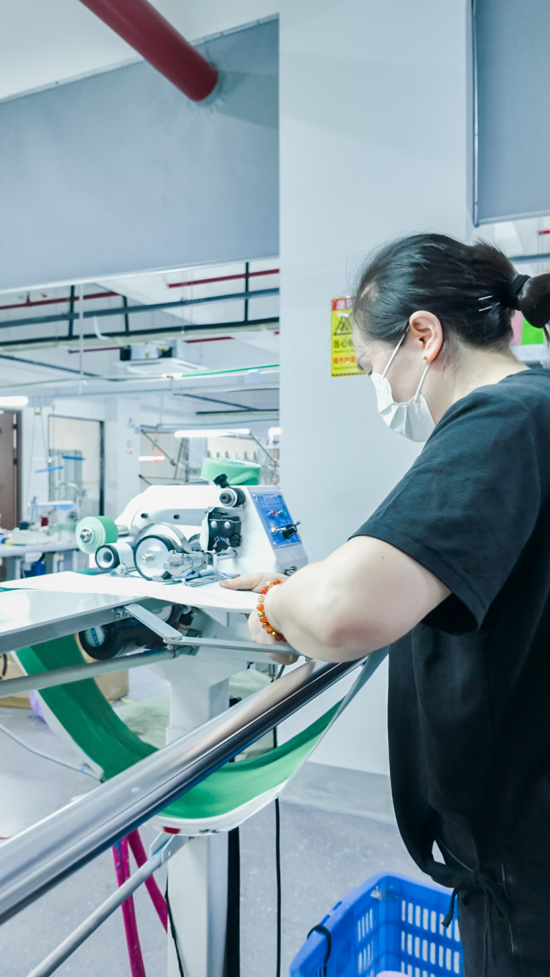 Operator working with garment production equipment